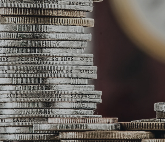 coins stacked representing Corporate Property Law