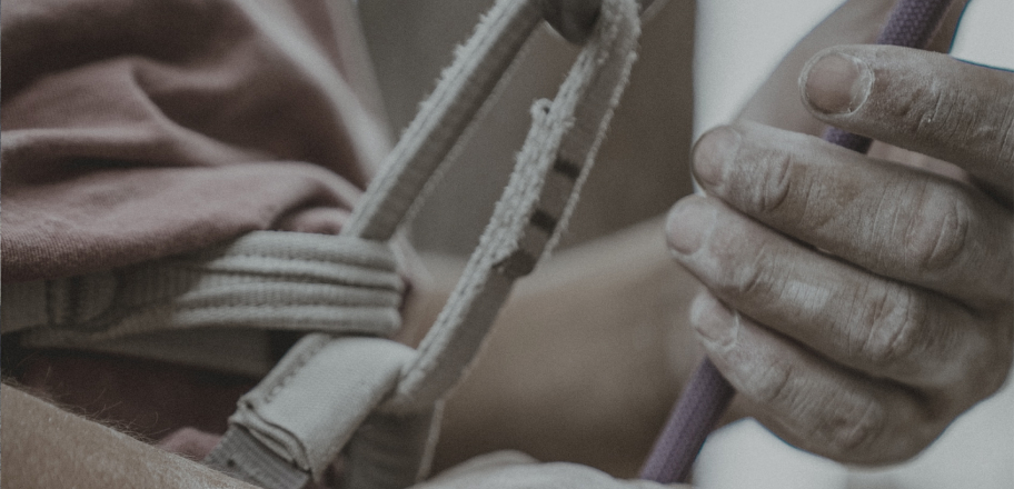 man putting together rope